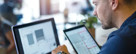 Man looking at data on a computer